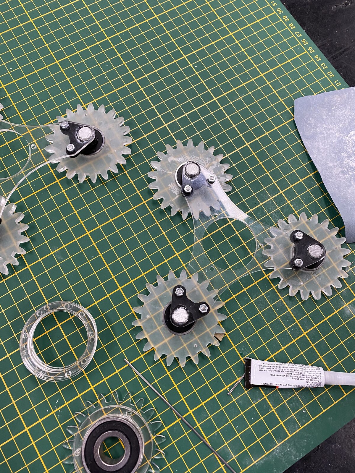 Planet gears laid out on cutting mat